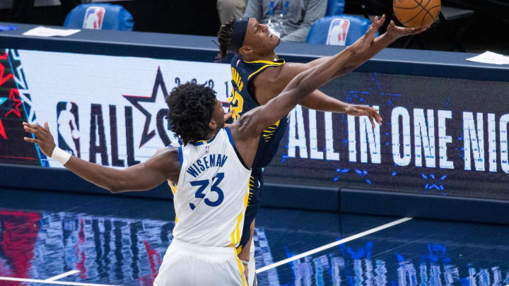 Feb 24, 2021; Indianapolis, Indiana, USA; Indiana Pacers center Myles Turner (33) shoots the ball while Golden State Warriors center James Wiseman (33) defends  in the third quarter at Bankers Life Fieldhouse. Mandatory Credit: Trevor Ruszkowski-USA TODAY Sports