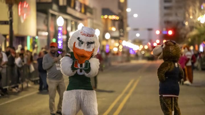 Feb 2, 2024; Mobile, AL, USA; Miami Hurricanes mascot Sebastian the Ibis warms up the crowd as Senior Bowl football players participate in the Mardi Gras player parade Friday in downtown Mobile. Mandatory Credit: Vasha Hunt-USA TODAY Sports