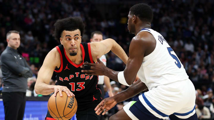 Apr 3, 2024; Minneapolis, Minnesota, USA; Toronto Raptors forward Jordan Nwora (13) works around Minnesota Timberwolves guard Anthony Edwards (5) during the third quarter at Target Center. Mandatory Credit: Matt Krohn-USA TODAY Sports