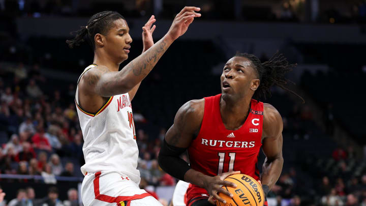 Mar 13, 2024; Minneapolis, MN, USA; Rutgers Scarlet Knights center Clifford Omoruyi (11) works around Maryland Terrapins forward Julian Reese (10) during the first half at Target Center. Mandatory Credit: Matt Krohn-USA TODAY Sports