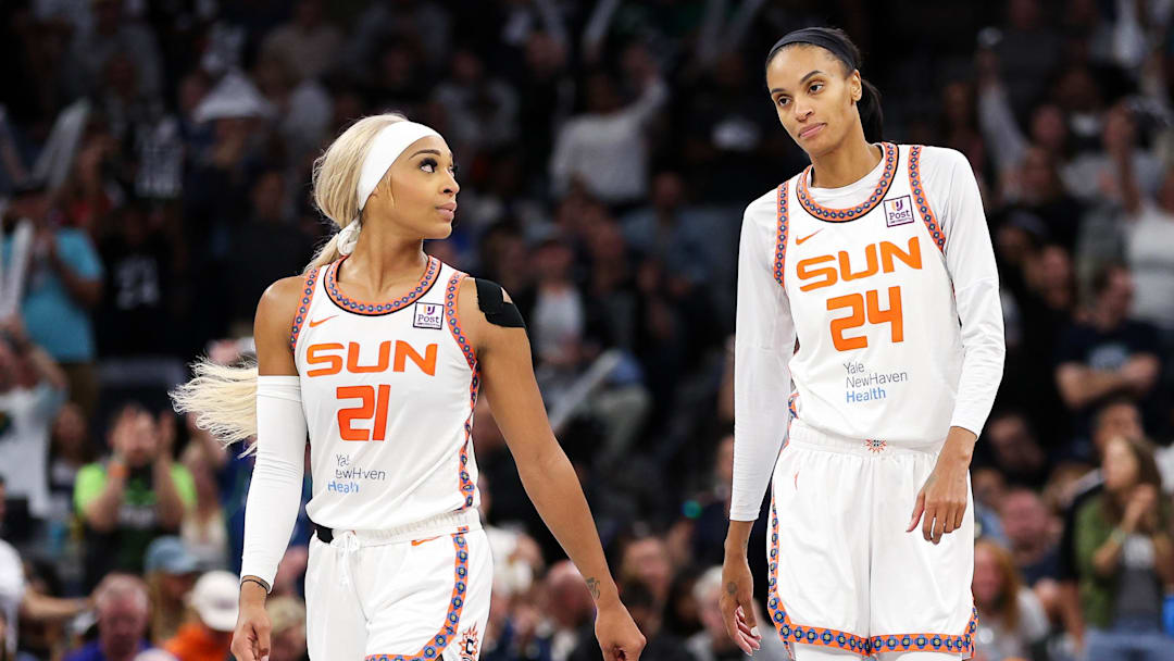 Oct 8, 2024; Minneapolis, Minnesota, USA; Connecticut Sun guard DiJonai Carrington (21) and forward DeWanna Bonner (24) look on during the second half of game five of the 2024 WNBA playoffs against the Minnesota Lynx at Target Center. Mandatory Credit: Matt Krohn-Imagn Images