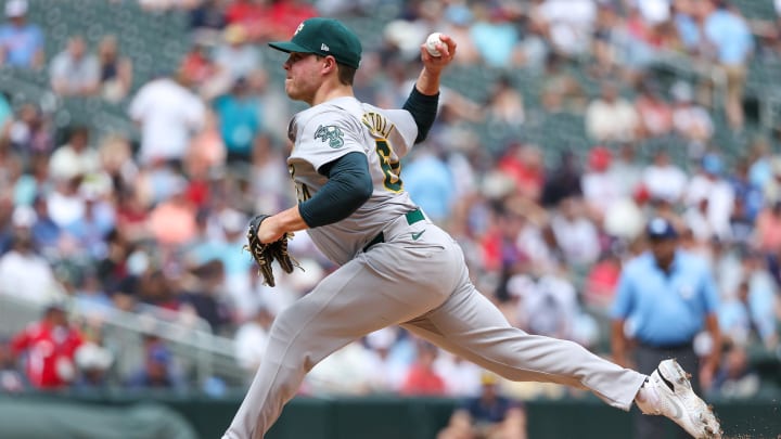 Jun 16, 2024; Minneapolis, Minnesota, USA; Oakland Athletics pitcher Vinny Nittoli (64) delivers a pitch against the Minnesota Twins during the sixth inning of game one of a double header at Target Field. Mandatory Credit: Matt Krohn-USA TODAY Sports