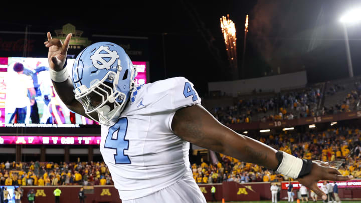 North Carolina Tar Heels defensive lineman Travis Shaw celebrates his teams win against the Minnesota Golden Gophers after the game at Huntington Bank Stadium.