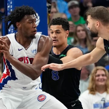 Apr 12, 2024; Dallas, Texas, USA; Detroit Pistons center James Wiseman (13) looks to score against Dallas Mavericks guard Josh Green (8) during the first half at American Airlines Center. Mandatory Credit: Chris Jones-USA TODAY Sports