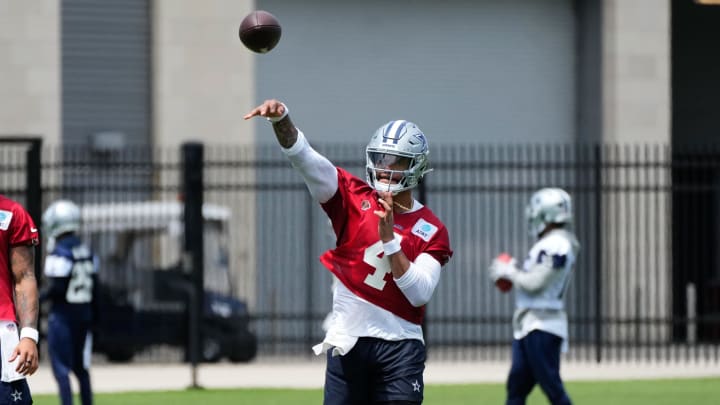 Jun 5, 2024; Frisco, TX, USA;  Dallas Cowboys quarterback Dak Prescott (4) goes through a drill during practice at the Ford Center at the Star Training Facility in Frisco, Texas. Mandatory Credit: Chris Jones-USA TODAY Sports