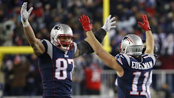 Jan 10, 2015; Foxborough, MA, USA; New England Patriots wide receiver Julian Edelman (11) celebrates with Patriots tight end Rob Gronkowski (87) after throwing a touchdown pass during the fourth quarter against the Baltimore Ravens in the 2014 AFC Divisional playoff football game at Gillette Stadium. The Patriots won 35-31. Mandatory Credit: Winslow Townson-Imagn Images