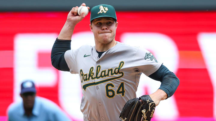 Jun 16, 2024; Minneapolis, Minnesota, USA; Oakland Athletics pitcher Vinny Nittoli (64) delivers a pitch against the Minnesota Twins during the fifth inning of game one of a double header at Target Field. Mandatory Credit: Matt Krohn-USA TODAY Sports