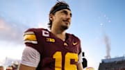 Oct 26, 2024; Minneapolis, Minnesota, USA; Minnesota Golden Gophers quarterback Max Brosmer (16) celebrates his teams win after the game against the Maryland Terrapins at Huntington Bank Stadium.