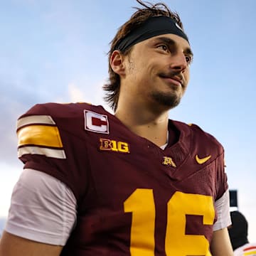 Oct 26, 2024; Minneapolis, Minnesota, USA; Minnesota Golden Gophers quarterback Max Brosmer (16) celebrates his teams win after the game against the Maryland Terrapins at Huntington Bank Stadium.