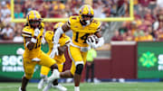 Sep 14, 2024; Minneapolis, Minnesota, USA; Minnesota Golden Gophers defensive back Kerry Brown (14) runs the ball after intercepting a pass against the Nevada Wolf Pack during the first half at Huntington Bank Stadium. Mandatory Credit: Matt Krohn-Imagn Images