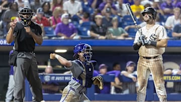 May 23, 2024; Hoover, AL, USA; South Carolina Gamecocks catcher Cole Messina (19) reacts to a strike call as LSU Tigers catcher Alex Milazzo (7) returns the ball to the pitcher during the SEC Baseball Tournament at Hoover Metropolitan Stadium. Mandatory Credit: Vasha Hunt-USA TODAY Sports