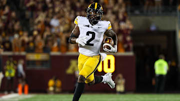 Sep 21, 2024; Minneapolis, Minnesota, USA; Iowa Hawkeyes running back Kaleb Johnson (2) runs the ball against the Minnesota Golden Gophers during the second half at Huntington Bank Stadium. Mandatory Credit: Matt Krohn-Imagn Images