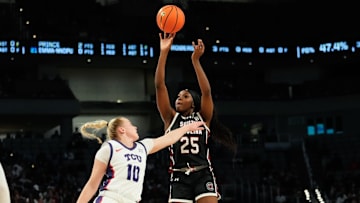 Dec 8, 2024; Fort Worth, Texas, USA;  South Carolina Gamecocks guard Raven Johnson (25) scores a basket over TCU Horned Frogs guard Hailey Van Lith (10) during the first half at Dickies Arena. Mandatory Credit: Chris Jones-Imagn Images