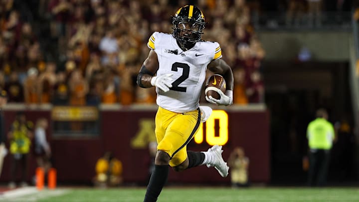 Sep 21, 2024; Minneapolis, Minnesota, USA; Iowa Hawkeyes running back Kaleb Johnson (2) runs the ball against the Minnesota Golden Gophers during the second half at Huntington Bank Stadium. Mandatory Credit: Matt Krohn-Imagn Images