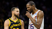 Feb 10, 2024; San Francisco, California, USA; Golden State Warriors guard Stephen Curry (30) and Phoenix Suns forward Kevin Durant (35) talk during the second half at Chase Center. Mandatory Credit: John Hefti-Imagn Images