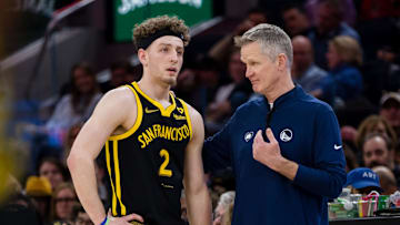 Feb 14, 2024; San Francisco, California, USA; Golden State Warriors head coach Steve Kerr talks to guard Brandin Podziemski (2) during the second half of the game against the LA Clippers at Chase Center. Mandatory Credit: John Hefti-Imagn Images