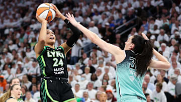 Oct 16, 2024; Minneapolis, Minnesota, USA; Minnesota Lynx forward Napheesa Collier (24) shoots as New York Liberty forward Breanna Stewart (30) defends during the first half of game three of the 2024 WNBA Finals at Target Center. Mandatory Credit: Matt Krohn-Imagn Images