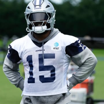 Jun 5, 2024; Frisco, TX, USA;  Dallas Cowboys running back Ezekiel Elliott (15) goes through a drill during practice at the Ford Center at the Star Training Facility in Frisco, Texas. 