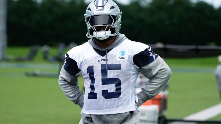 Jun 5, 2024; Frisco, TX, USA;  Dallas Cowboys running back Ezekiel Elliott (15) goes through a drill during practice at the Ford Center at the Star Training Facility in Frisco, Texas. 