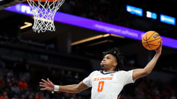 Mar 15, 2024; Minneapolis, MN, USA; Illinois Fighting Illini guard Terrence Shannon Jr. (0) dunks against the Ohio State Buckeyes during the first half at Target Center. Mandatory Credit: Matt Krohn-USA TODAY Sports