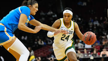 Jan 20, 2025; Newark, New Jersey, USA;  Baylor Lady Bears guard Sarah Andrews (24) drives to the basket against UCLA Bruins center Lauren Betts (51) during the first half at Prudential Center. Mandatory Credit: Chris Jones-Imagn Images