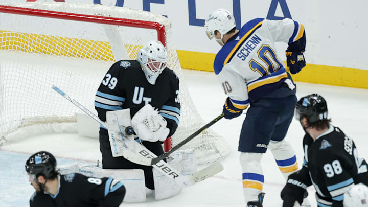 Feb 2, 2025; Salt Lake City, Utah, USA; Utah Hockey Club goaltender Connor Ingram (39) blocks the shot of St. Louis Blues center Brayden Schenn (10) during the second period at Delta Center. Mandatory Credit: Chris Nicoll-Imagn Images
