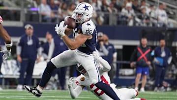 Nov 28, 2024; Arlington, Texas, USA; Dallas Cowboys tight end Luke Schoonmaker (86) catches a pass as New York Giants safety Dane Belton (24) defends during the first half at AT&T Stadium.
