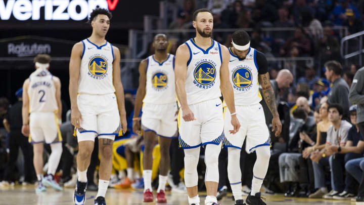 Golden State Warriors guard Stephen Curry (30) and guard Brandin Podziemski (2) and other players walk on the court after a time-out during the first half of the game against the New York Knicks at Chase Center. Mandatory Credit: 