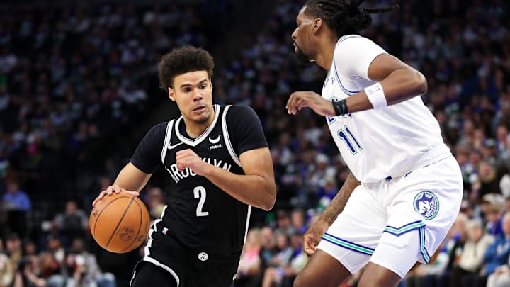 Feb 24, 2024; Minneapolis, Minnesota, USA; Brooklyn Nets forward Cameron Johnson (2) works around Minnesota Timberwolves center Naz Reid (11) during the second half at Target Center. Mandatory Credit: Matt Krohn-Imagn Images