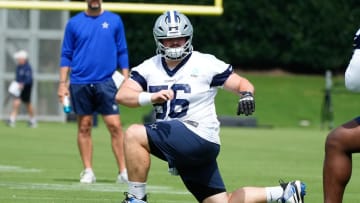 Jun 5, 2024; Frisco, TX, USA;  Dallas Cowboys center Cooper Beebe (56) goes through a drill during practice at the Ford Center at the Star Training Facility in Frisco, Texas. Mandatory Credit: Chris Jones-USA TODAY Sports
