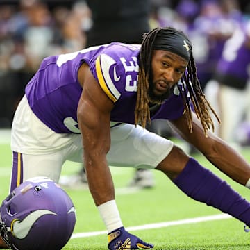 Oct 20, 2024; Minneapolis, Minnesota, USA; Minnesota Vikings running back Aaron Jones (33) stretches before the game against the Detroit Lions at U.S. Bank Stadium. Mandatory Credit: Matt Krohn-Imagn Images