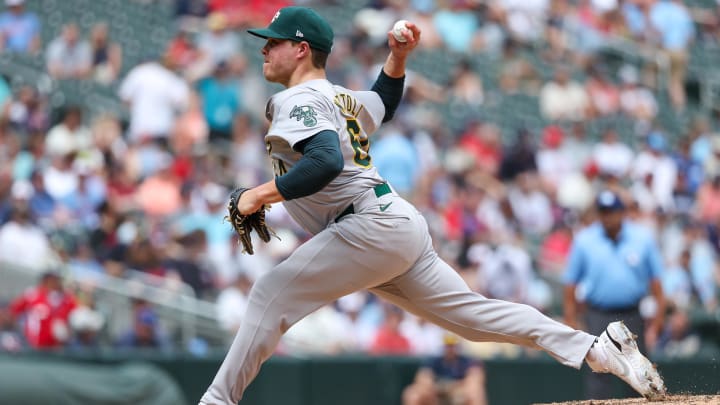Jun 16, 2024; Minneapolis, Minnesota, USA; Oakland Athletics pitcher Vinny Nittoli (64) delivers a pitch against the Minnesota Twins during the sixth inning of game one of a double header at Target Field.