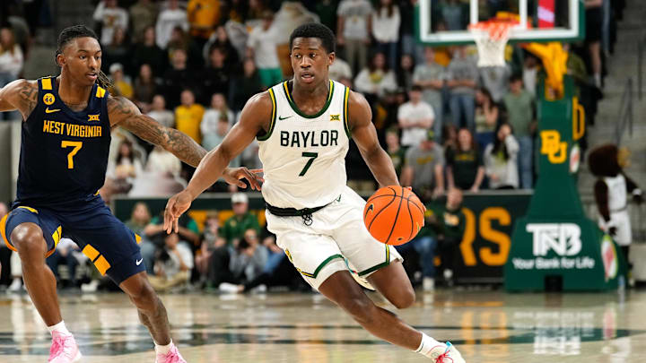 Feb 15, 2025; Waco, Texas, USA; Baylor Bears guard VJ Edgecombe (7) drives to the basket ahead of West Virginia Mountaineers guard Javon Small (7) during the second half at Paul and Alejandra Foster Pavilion. Mandatory Credit: Chris Jones-Imagn Images Feb 15, 2025; Waco, Texas, USA; Baylor Bears guard VJ Edgecombe (7) drives to the basket ahead of West Virginia Mountaineers guard Javon Small (7) during the second half at Paul and Alejandra Foster Pavilion. Mandatory Credit: Chris Jones-Imagn Images