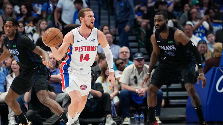 Apr 12, 2024; Dallas, Texas, USA; Detroit Pistons guard Malachi Flynn (14)  controls the ball as Dallas Mavericks forward Tim Hardaway Jr. (10) defends during the first half at American Airlines Center. Mandatory Credit: Chris Jones-USA TODAY Sports