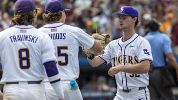 May 25, 2024; Hoover, AL, USA; LSU Tigers pitcher Kade Anderson (32) is greeted by teammates after getting out of the nonthinking unscathed against the South Carolina Gamecocks during the SEC Baseball Tournament at Hoover Metropolitan Stadium. Mandatory Credit: Vasha Hunt-Imagn Images