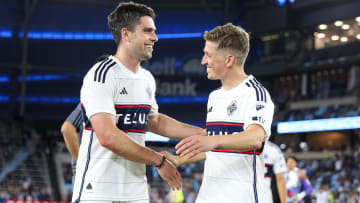 Jul 3, 2024; Saint Paul, Minnesota, USA; Vancouver Whitecaps FC forward Brian White (24) and midfielder Ryan Gauld (25) celebrates their teams win after the game at Allianz Field. Mandatory Credit: Matt Krohn-USA TODAY Sports