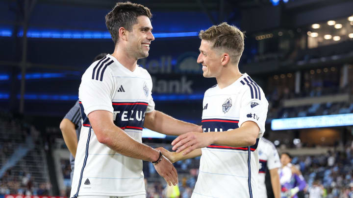 Jul 3, 2024; Saint Paul, Minnesota, USA; Vancouver Whitecaps FC forward Brian White (24) and midfielder Ryan Gauld (25) celebrates their teams win after the game at Allianz Field. Mandatory Credit: Matt Krohn-USA TODAY Sports