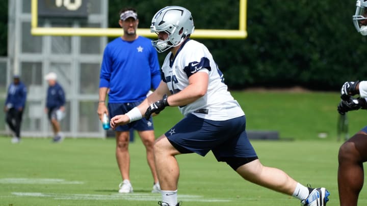 Jun 5, 2024; Frisco, TX, USA;  Dallas Cowboys center Cooper Beebe (56) goes through a drill during practice at the Ford Center at the Star Training Facility in Frisco, Texas.