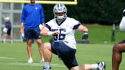 Jun 5, 2024; Frisco, TX, USA;  Dallas Cowboys center Cooper Beebe (56) goes through a drill during practice at the Ford Center at the Star Training Facility in Frisco, Texas. Mandatory Credit: Chris Jones-USA TODAY Sports