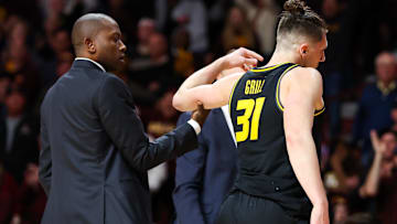 Missouri Tigers guard Caleb Grill (31) talks with head coach Dennis Gates during a game versus the Minnesota Golden Gophers last season.