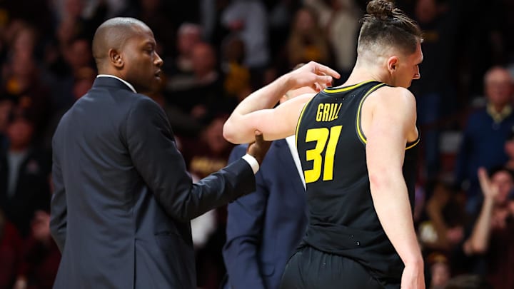 Missouri Tigers guard Caleb Grill (31) talks with head coach Dennis Gates during a game versus the Minnesota Golden Gophers last season.