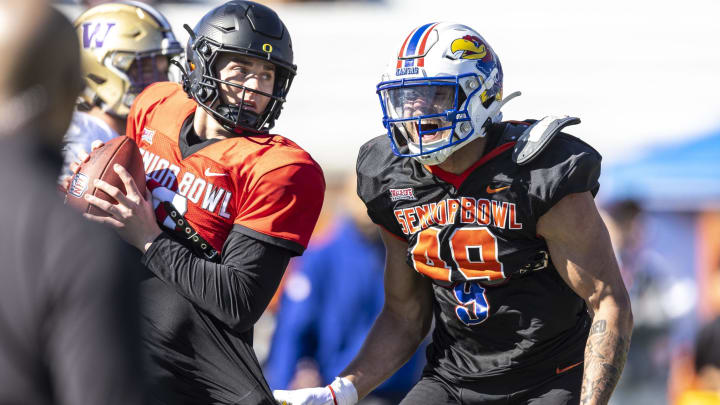 Jan 31, 2024; Mobile, AL, USA; National edge Austin Booker of Kansas (49) screams after a touch sack of National quarterback Bo Nix of Oregon (10) during practice for the National team at Hancock Whitney Stadium. Mandatory Credit: Vasha Hunt-USA TODAY Sports