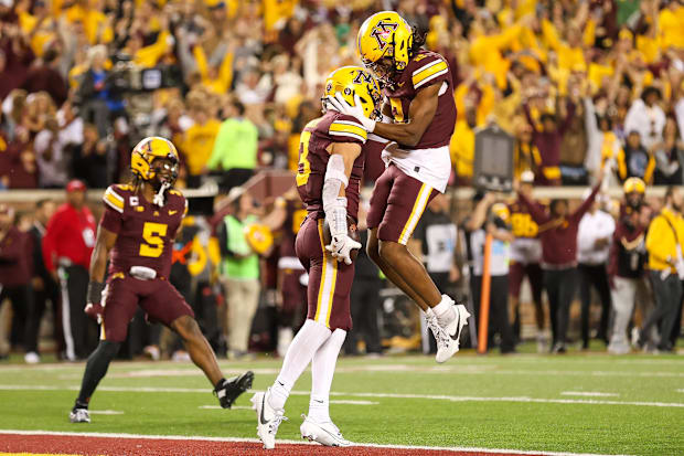 Minnesota Golden Gophers defensive back Koi Perich (3) celebrates his interception.