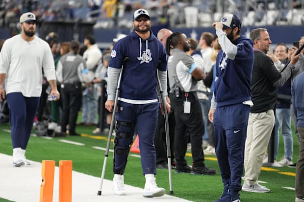 Dallas Cowboys quarterback Dak Prescott stands on crutches before the game against the New York Giants.