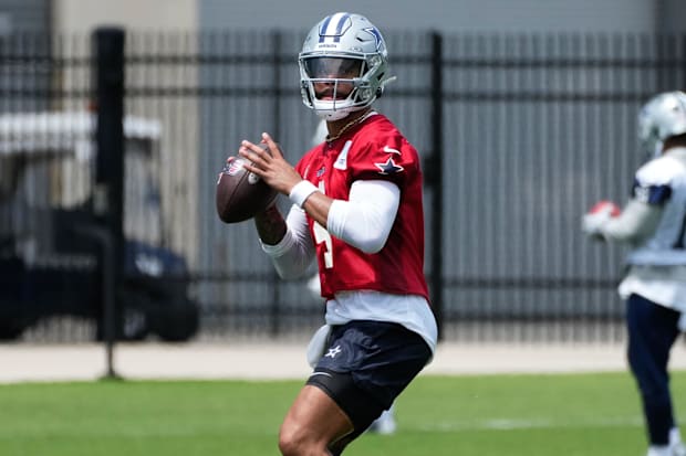Dallas Cowboys quarterback Dak Prescott goes through a drill during practice at the Ford Center at the Star Training Facility