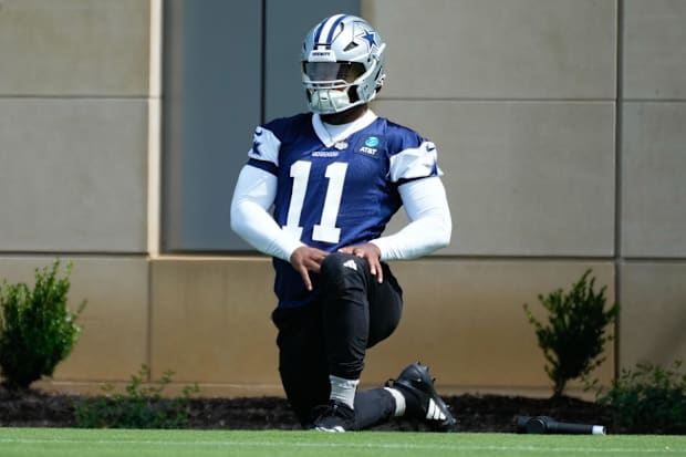 Dallas Cowboys star Micah Parson warms up during practice at the Ford Center at the Star Training Facility in Frisco, Texas.