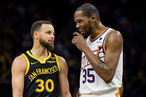 Golden State Warriors guard Stephen Curry (30) and Phoenix Suns forward Kevin Durant (35)