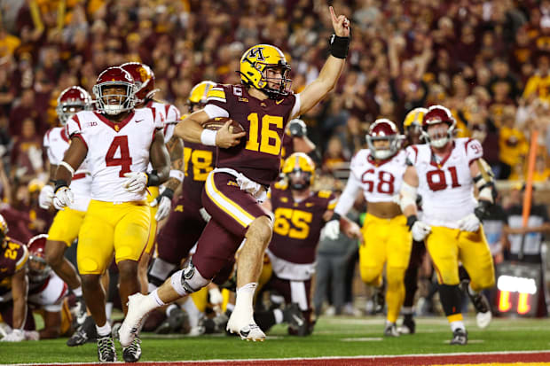 Minnesota quarterback Max Brosmer runs for a touchdown against USC.
