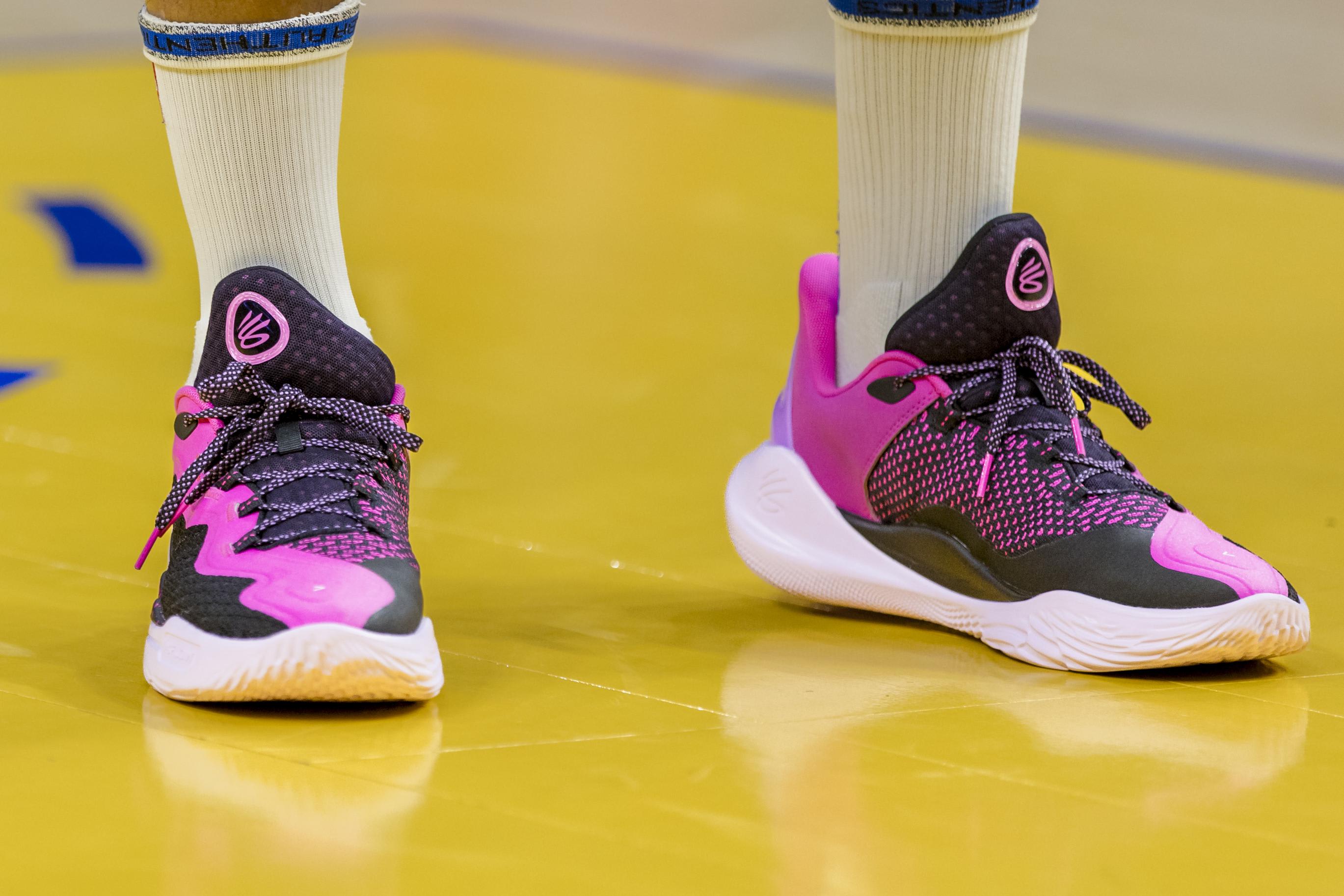 Golden State Warriors guard Stephen Curry's pink Under Armour sneakers.