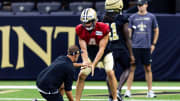 Aug 11, 2023; Metairie, LA, USA;  New Orleans Saints quarterback Derek Carr (4) works on offensive drills during training camp at the Caesars Superdome. Mandatory Credit: Stephen Lew-USA TODAY Sports